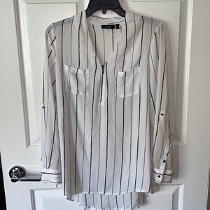Long sleeve half zip blouse.